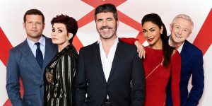 イギリスのオーディション番組xfactorについて書かれた記事中のイメージ画像です。番組の出演者が笑顔で横一列でならんでいます。